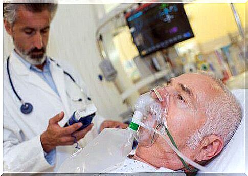Man gets oxygen through an oxygen mask