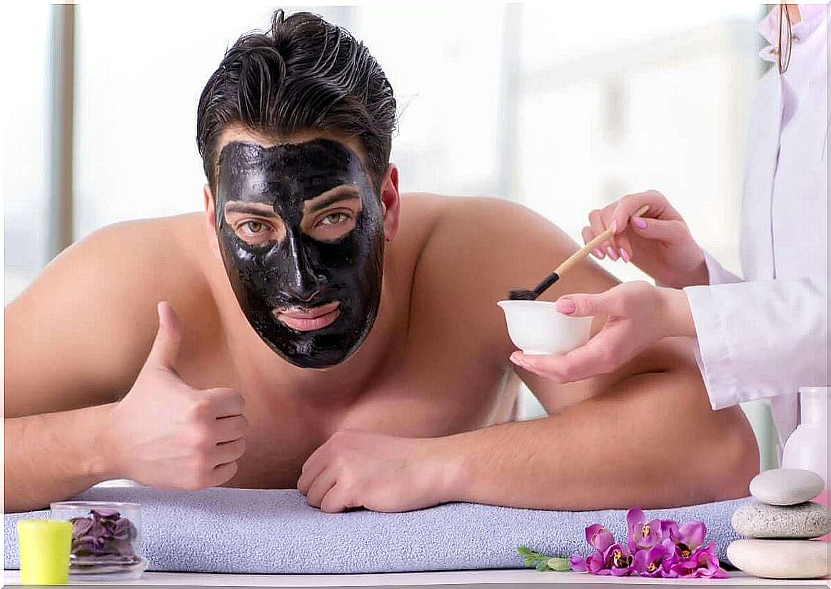 Man wears a black face mask