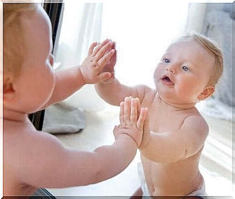 Baby in front of the mirror