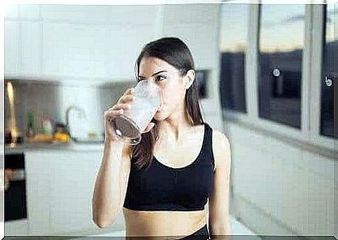 A woman drinking a protein shake