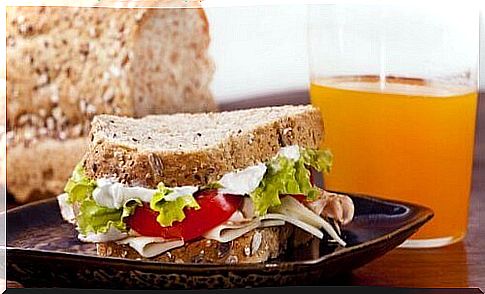 Turkey sandwich with orange juice